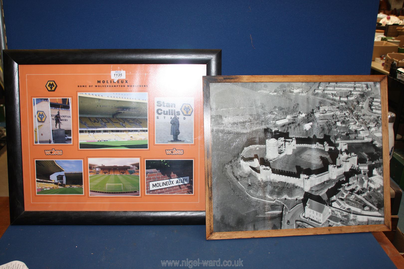 A framed black and white Photograph of a castle and a Poster of the Home of Wolverhampton Wanderers