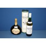 A bottle of Laphroaig Single Islay Malt Whisky in tube (70 cl) and a bottle of Mateus Rose (750 ml).