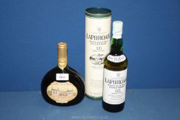 A bottle of Laphroaig Single Islay Malt Whisky in tube (70 cl) and a bottle of Mateus Rose (750 ml).