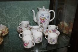 A pretty Crown Derby Teaset in 'Derby Posies' pattern including six cups and saucers, teapot,