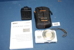 A white Nikon Coolpix S7000 16 mega pixels digital camera with Nikon 20 x 4.5 - 90 mm lens f/1:3.