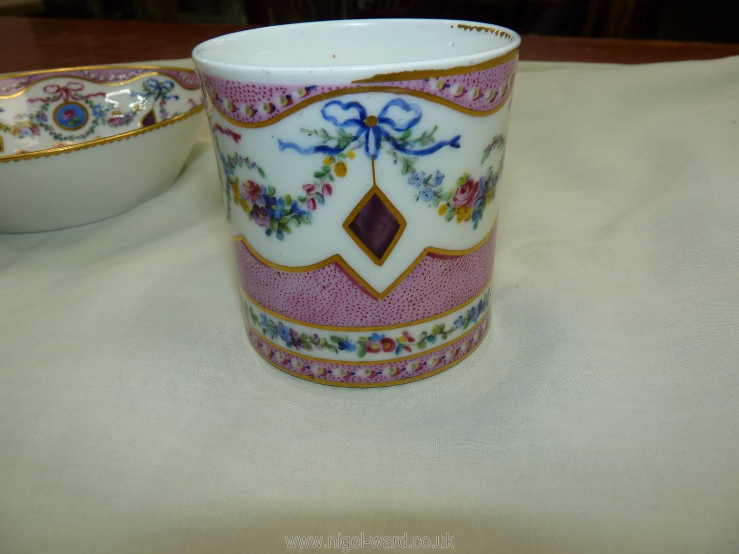 A Sevres coffee can and saucer, painted with floral garlands against a mottled salmon pink ground, - Image 9 of 13