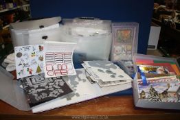 Two boxes of card making accessories in individual folders and boxes.