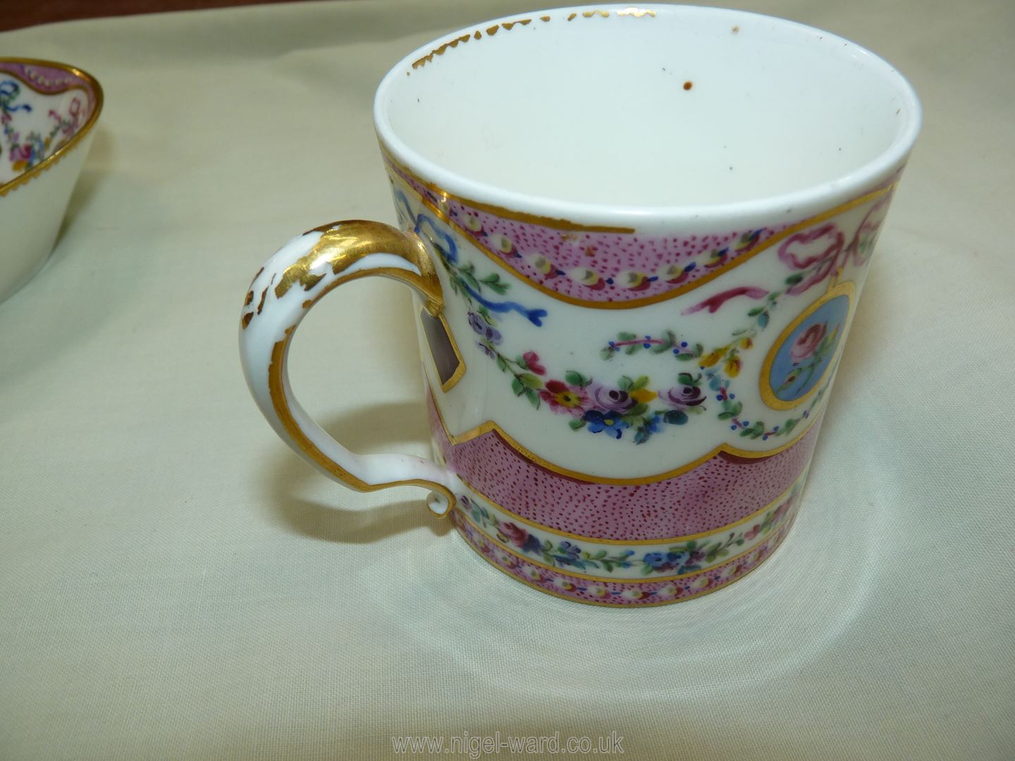 A Sevres coffee can and saucer, painted with floral garlands against a mottled salmon pink ground, - Image 12 of 13