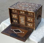 A pretty table top set of Drawers with extensive bone and Mother of Pearl inlay all over,