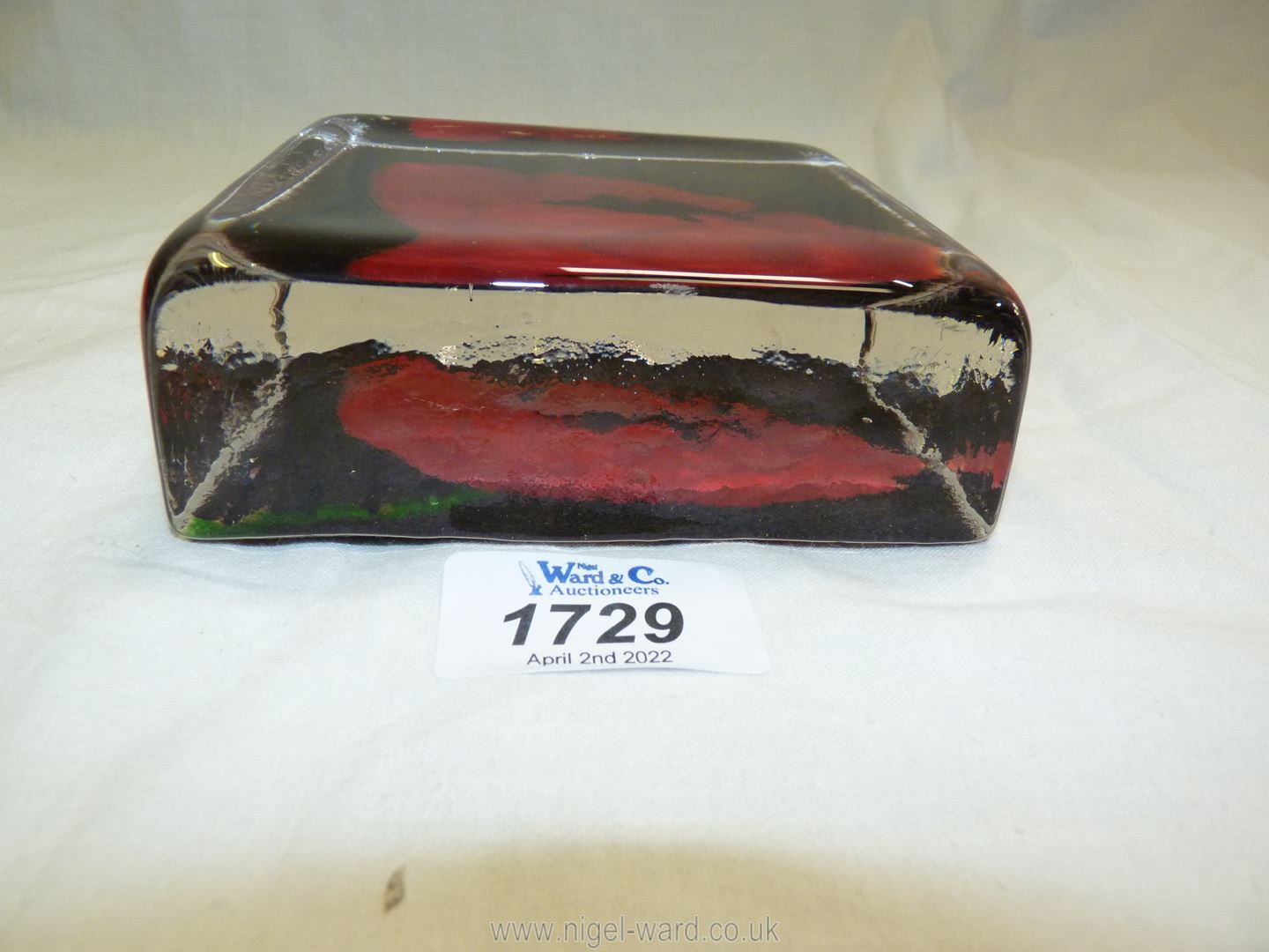 A heavy Caithness square 'Sandcast Glass' paperweight with Poppy resting on dark ground. - Image 2 of 3