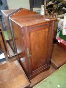 An Edwardian Walnut/Mahogany bedside Cabinet, 13 3/4'' wide x 13'' deep x 29 1/2'' high.