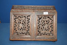 A two door stationary Box with oriental detailed carvings and letter racks, 16'' wide x 11'' x 9''.