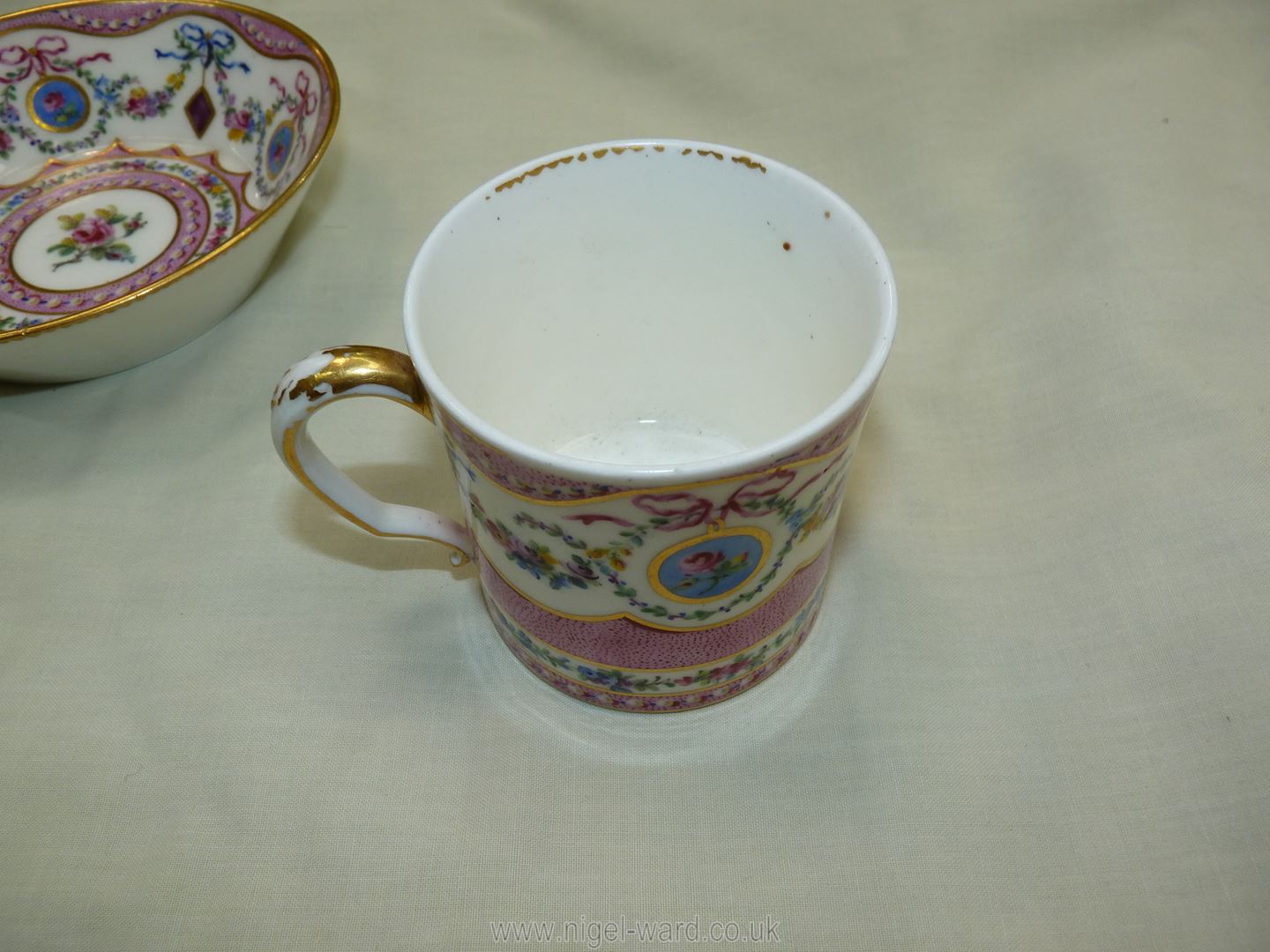 A Sevres coffee can and saucer, painted with floral garlands against a mottled salmon pink ground, - Image 7 of 13