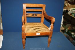 A child's Chair in the form of a regency carver with turned fluted columns,