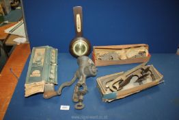 A vintage food mincer, small Scholz German barometer and quantity of boxed ice skate blades.