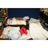 A quantity of linen including embroidered cloths, place mats, dressing table mats, etc.