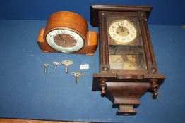 A Smiths wooden mantle Clock with key, 10 1/2'' wide x 7 1/2'' tall and a wall Clock,