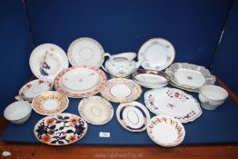 A quantity of various plates and saucers including gilt, blue and orange,