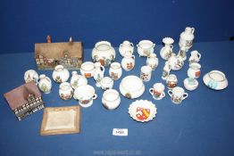 A quantity of Goss crested china including two cottages,