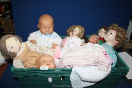 A crate of dolls including rag dolls, plastic etc.