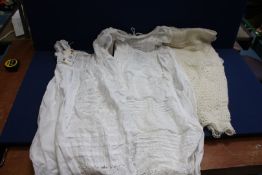 Two Christening Gowns with Broderie Anglaise detail, (one marked) plus a knitted baby's shawl.