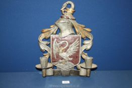 A metal wall Sconce having a coat of arms and Bohun swan style motif, 16 1/2" x 12".