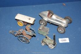 A quantity of vintage metal toy vehicles including Schuco Germany racing car,