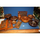 A quantity of treen including footed bowls, panels, etc.