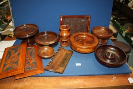 A quantity of treen including footed bowls, panels, etc.