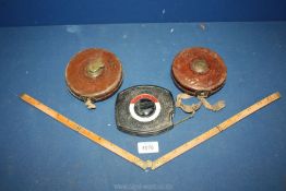 Two Rabone & Sons Leather Tape Measures, one 30m and a small wooden ruler.