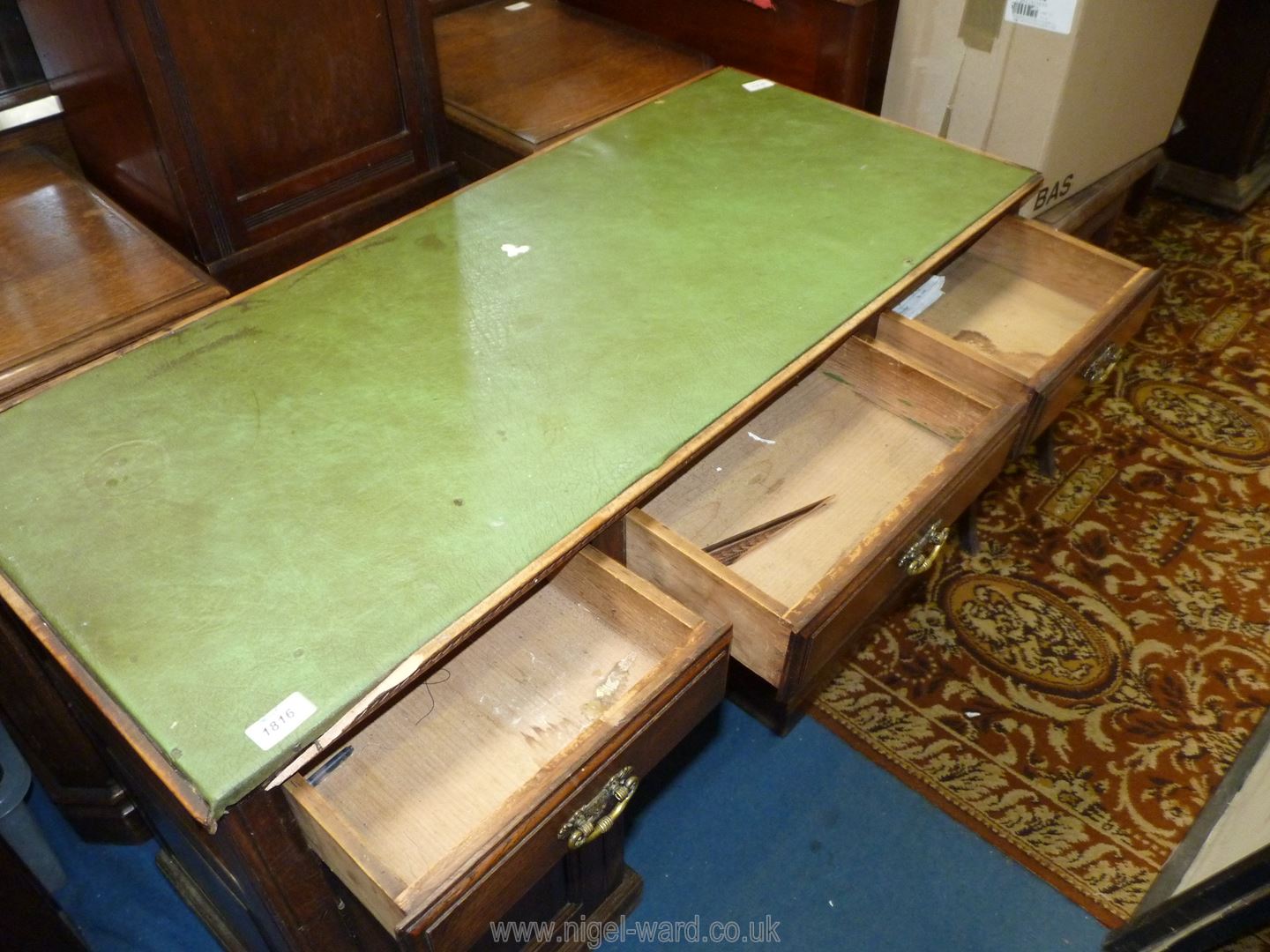 A diminutive circa 1900 Oak Kneehole Desk having three frieze drawers, - Image 2 of 3