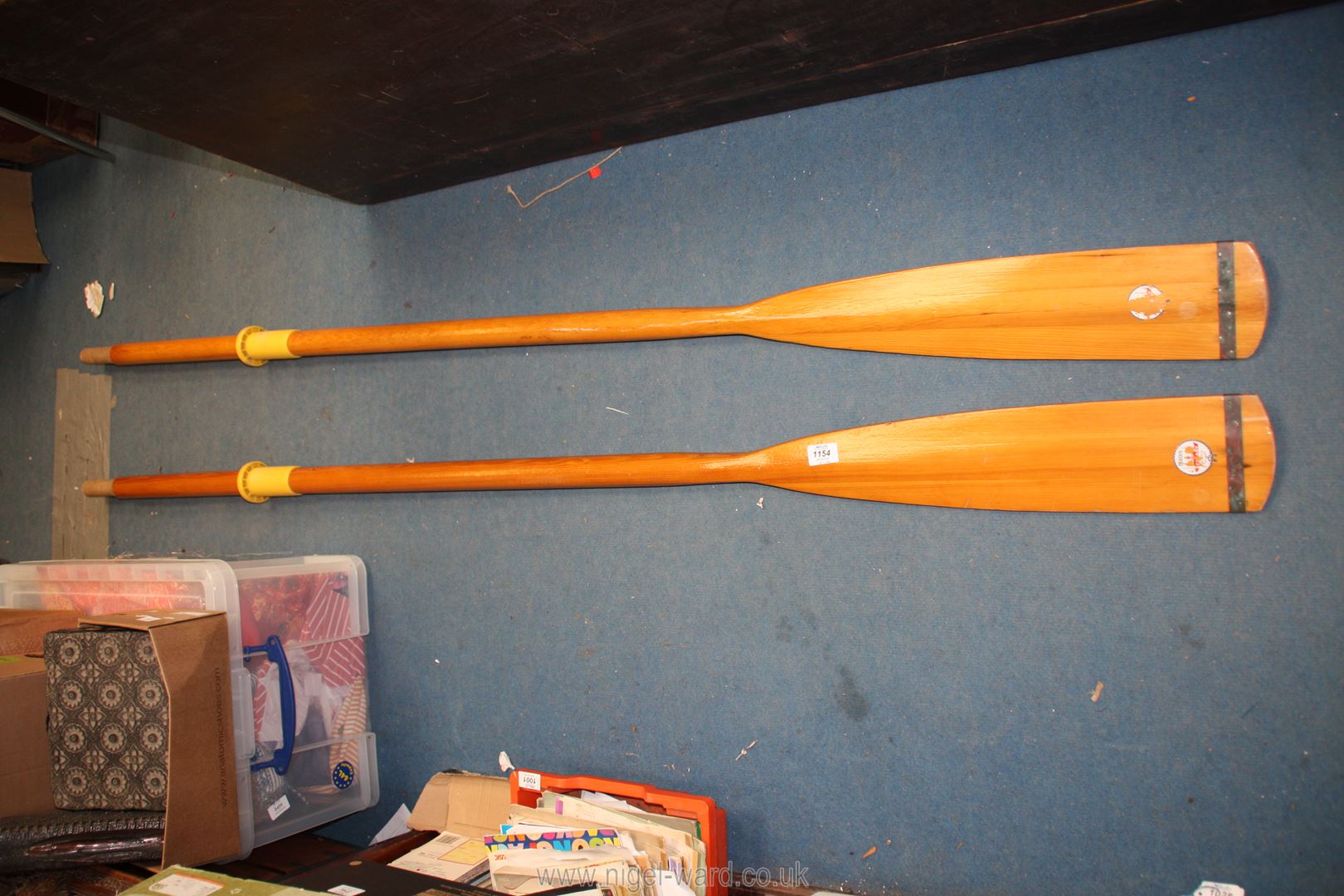 A pair of wooden rowing oars, labelled Borden Estuary,