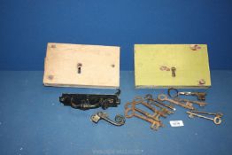 Two wooden door locks, door latch and old keys.