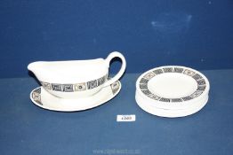 A quantity of Wedgwood Asia Black china to include eight side plates, sauce boat and stand.