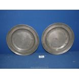 A pair of 9" Georgian pewter plates with single reeded rims,