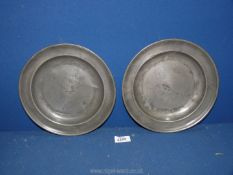 A pair of 9" Georgian pewter plates with single reeded rims,