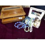 A white jewellery box and contents of beaded necklaces and rings plus a wooden jewellery box.