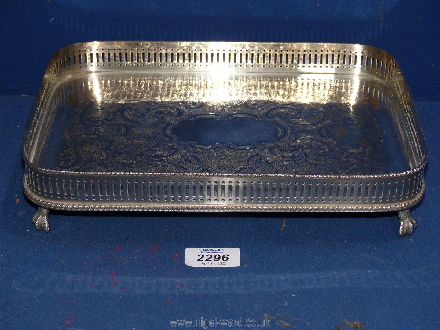 A plated galleried Tray, standing on four claw feet, 11 1/2'' x 8 1/2''.