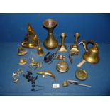 A quantity of brass including candlesticks, bell, dolphin, wall plaques, little ships clock,