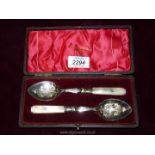 A presentation cased pair of high quality mother of pearl handled Spoons, the handles engraved 'M.D.
