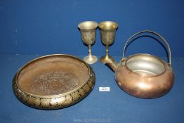 A large brass decorated bowl, copper kettle and two goblets.