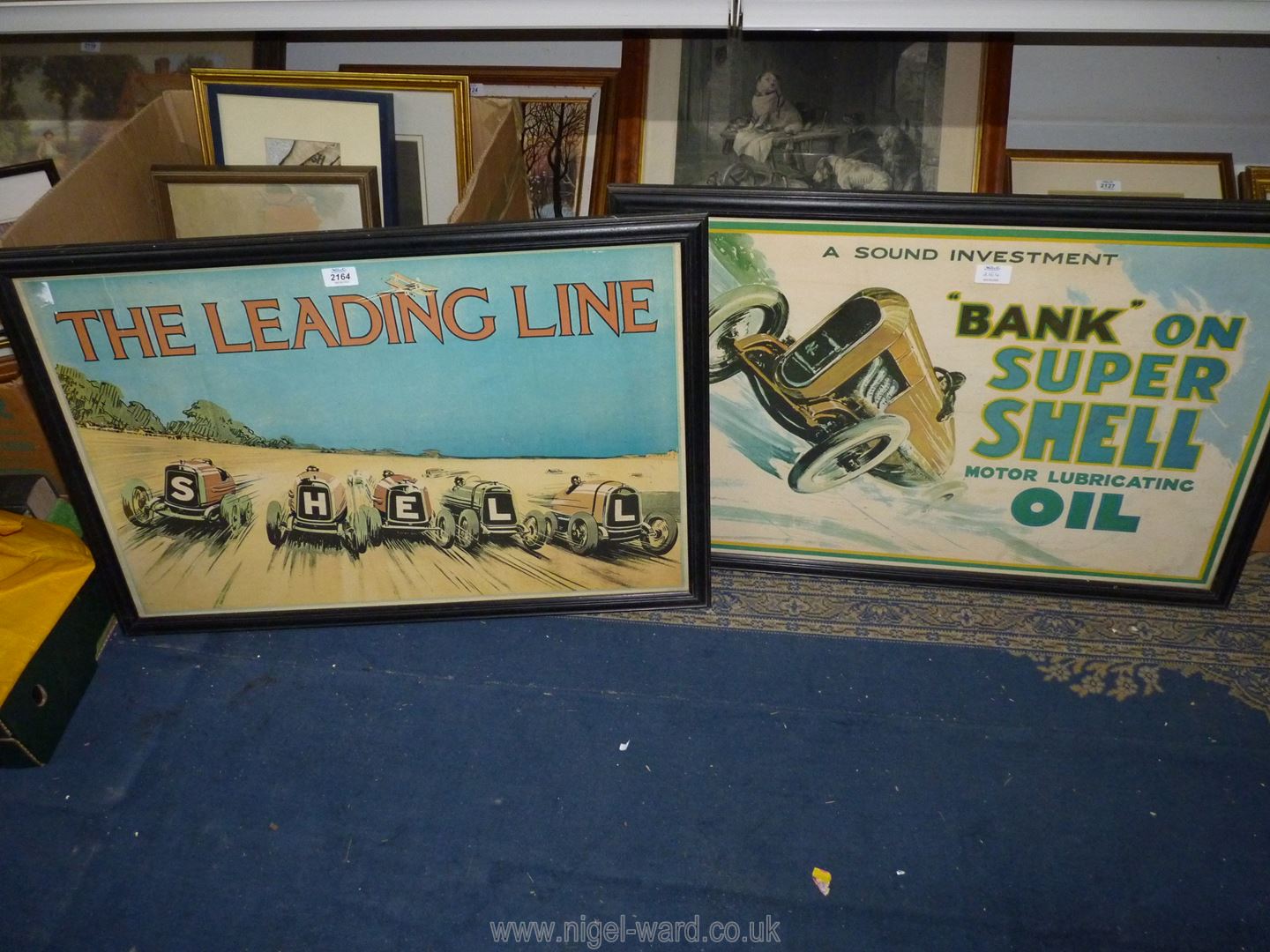 Two framed shell advertising posters 'Bank on Supershell' and 'The leading line' 32" x 22" incl.