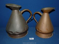 Two copper jugs.