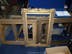 Four large decorative picture frames; the apertures suitable for pictures 28 3/4" x 21 1/2",