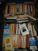 Two boxes of paperback novels to include; Ian Deighton, H.G. Wells, Dirk Bogarde, etc.