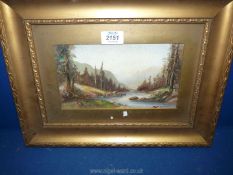 A gilt framed and mounted Watercolour depicting a tree lined river landscape,