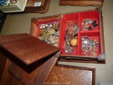 A wooden jewellery box and contents of brooches, necklaces etc.