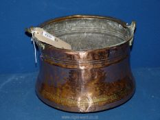 A copper bucket with brass handle, 12" x 11" x 8 1/2" tall.