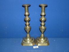 A pair of Candlesticks with pushers.