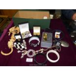 A box of fashion/costume jewellery with some boxed items including DKNY watch,