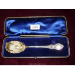 A presentation cased Silver Spoon having decoration in relief including to the shell design bowl,