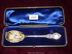A presentation cased Silver Spoon having decoration in relief including to the shell design bowl,