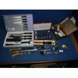 A quantity of boxed and loose cutlery including six piece knife set , display teaspoons,