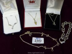 A quantity of 925 silver including pendants, chains and bulky link chain.